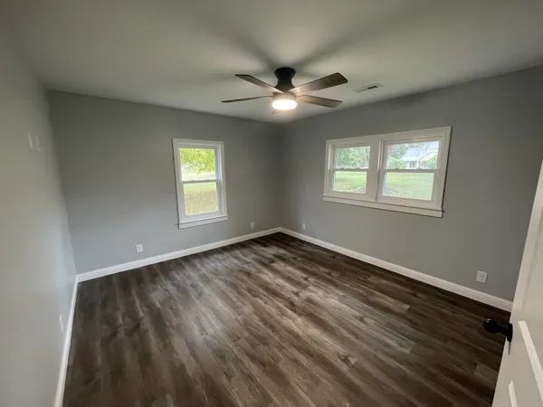 a view of an empty room and window