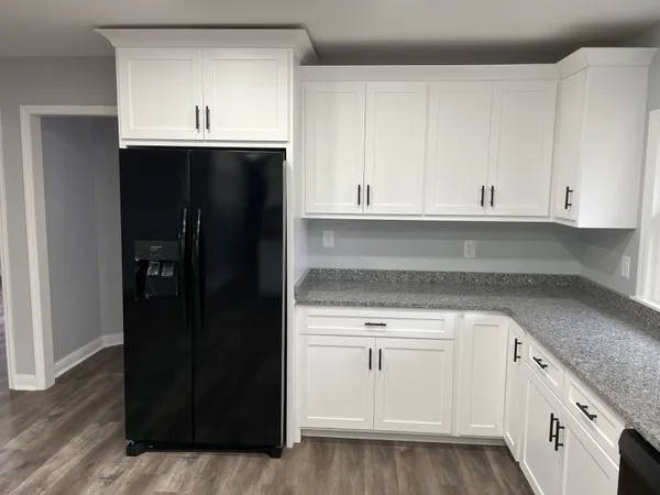 a view of cabinets with wooden floor