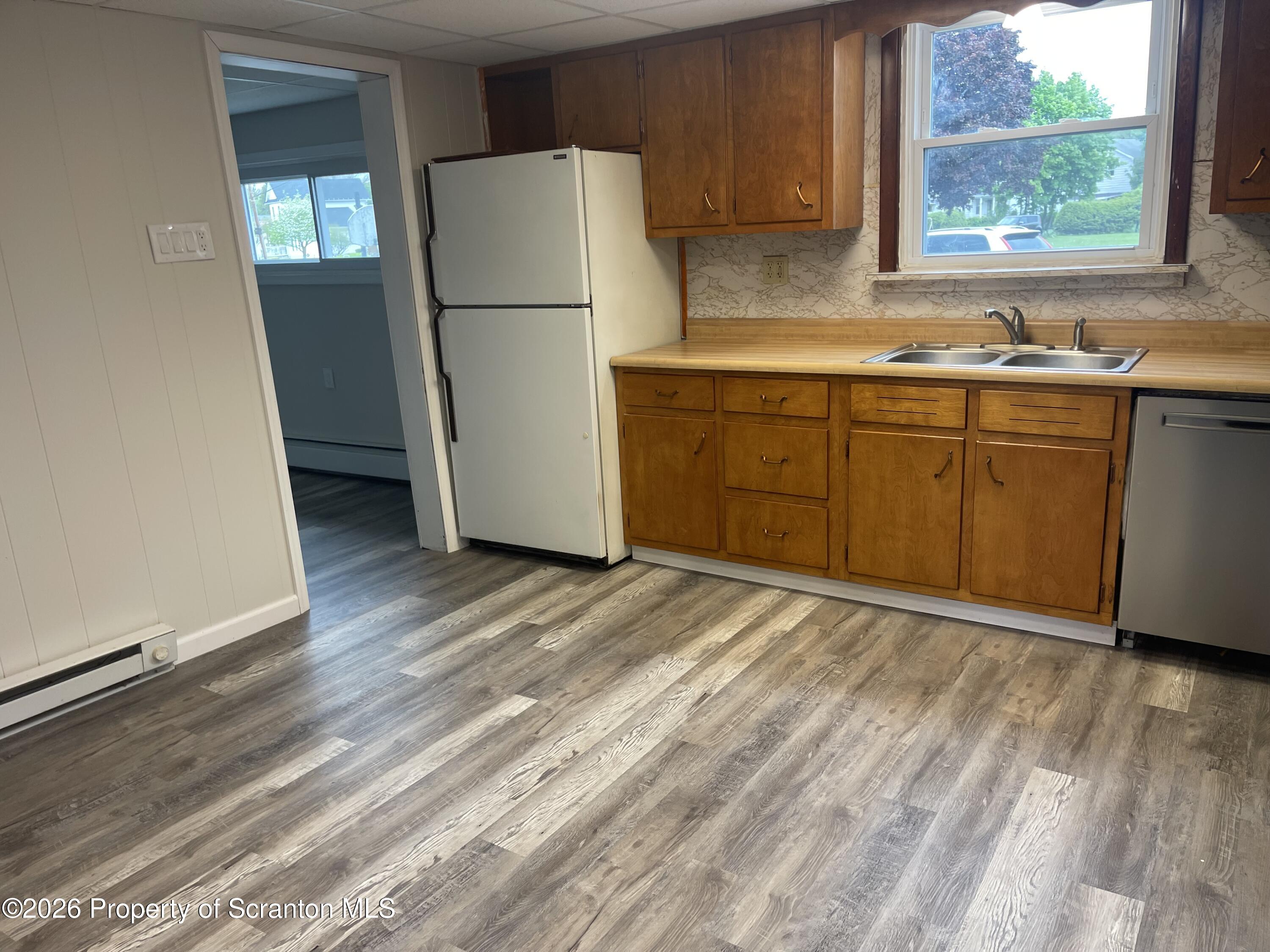 238 George Street Moosic, PA 18507 - Photo 5 of 23 a kitchen with a sink a refrigerator and window