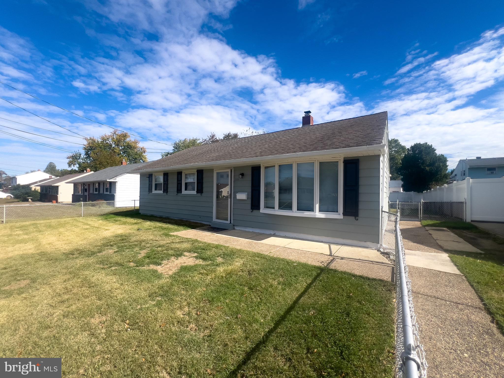 384 Windsor Drive Bellmawr, NJ 08031 - Photo 2 of 23 a front view of a house with a garden