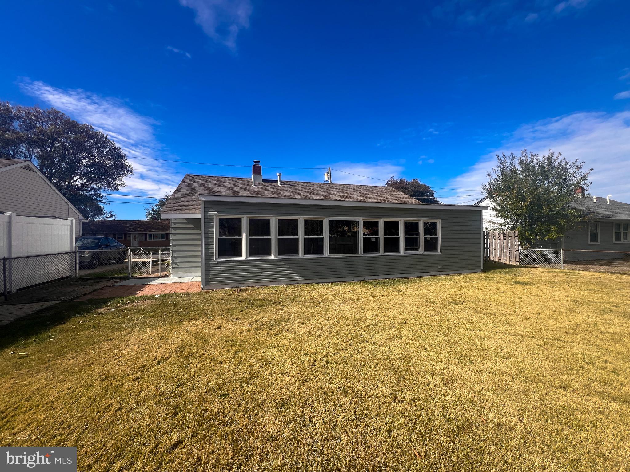 384 Windsor Drive Bellmawr, NJ 08031 - Photo 3 of 23 a view of a house with a backyard