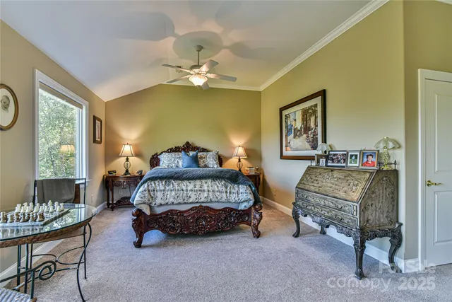 a bedroom with two beds and a window