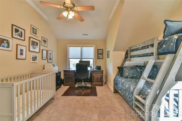 a bedroom with bed and cabinets