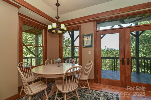 a kitchen with stainless steel appliances granite countertop a sink a stove cabinets counter space and a window
