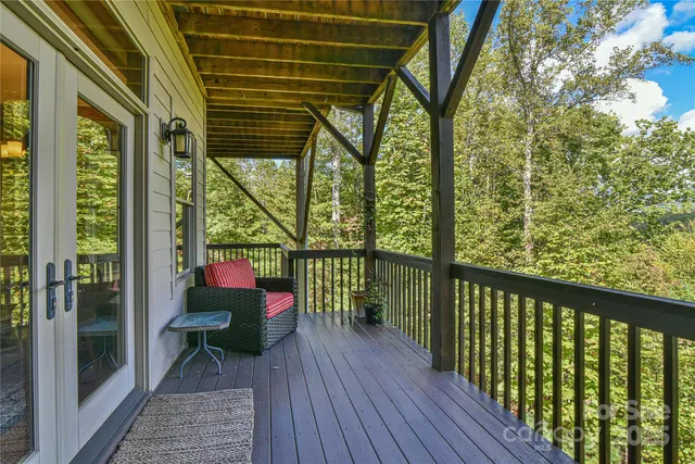a view of a two chairs in the balcony
