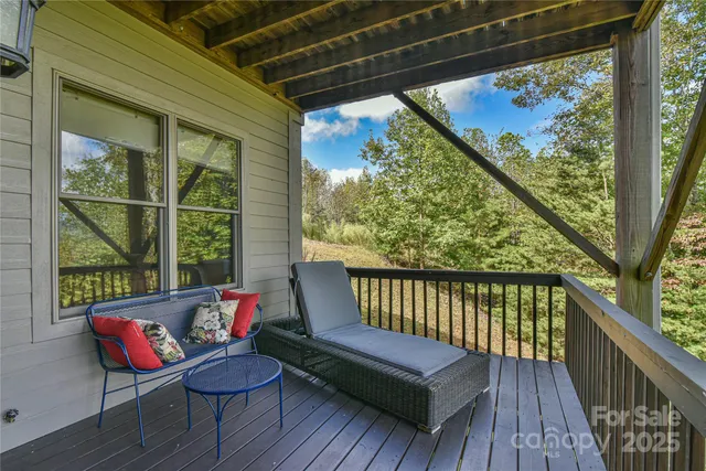 a view of a two chairs and table in the balcony
