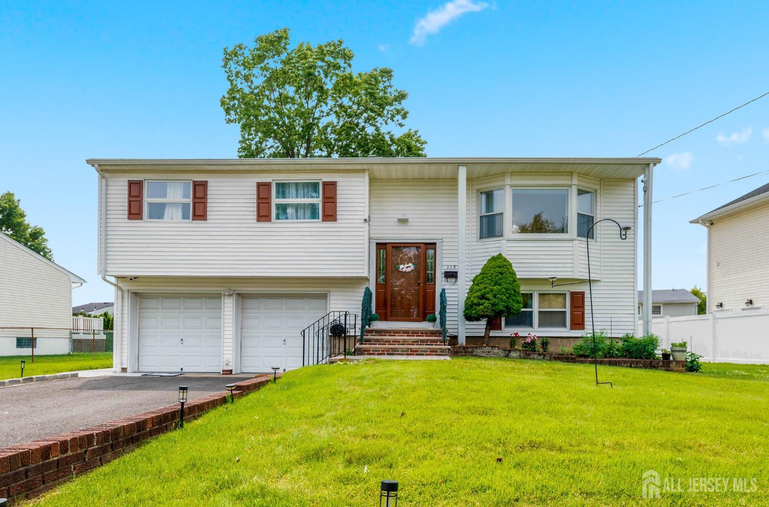 115 Vernon Way Port Reading, NJ 07064 - Photo 1 of 33 a view of a house with a swimming pool
