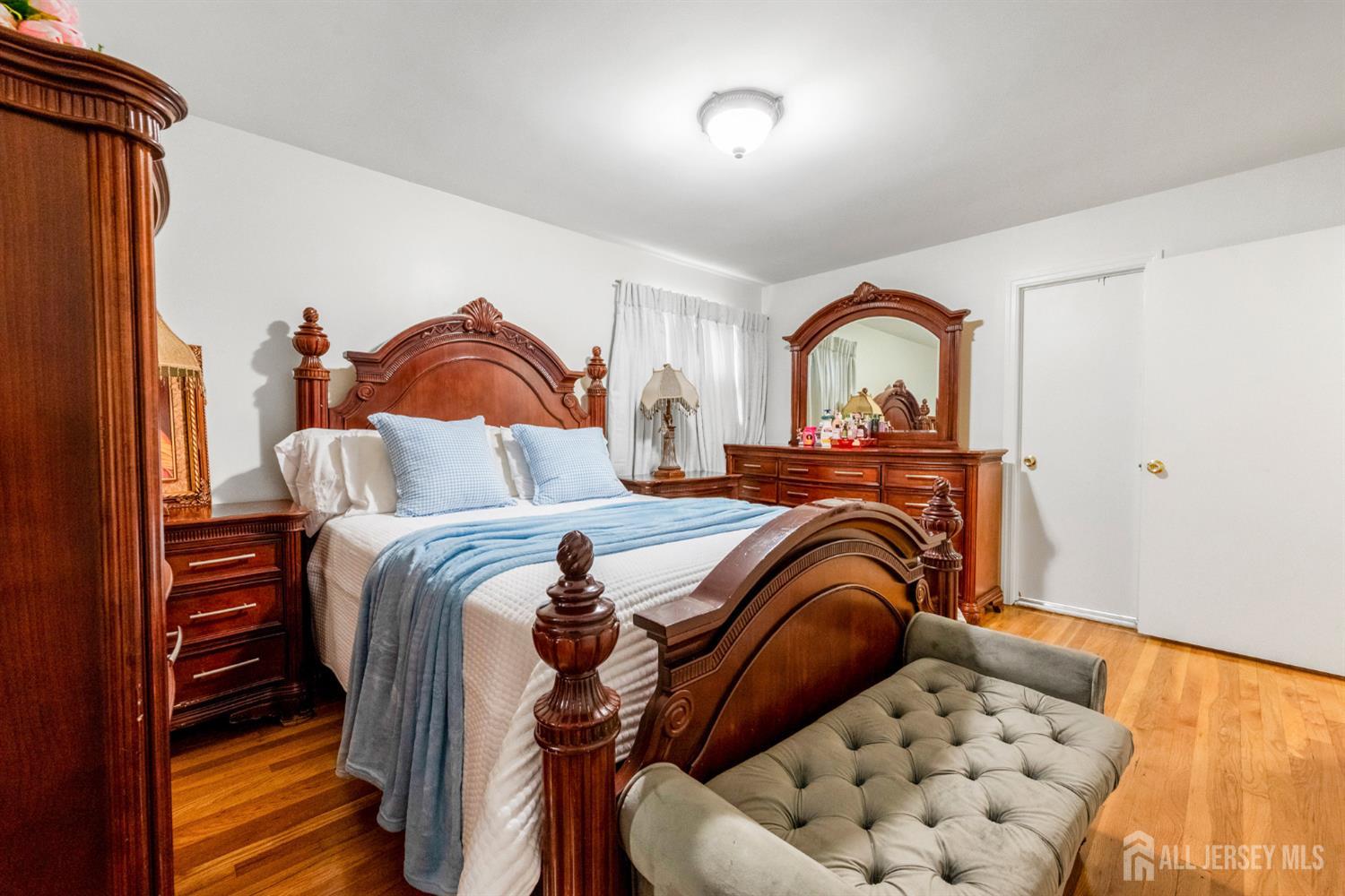 115 Vernon Way Port Reading, NJ 07064 - Photo 15 of 33 a bedroom with a bed and a couch