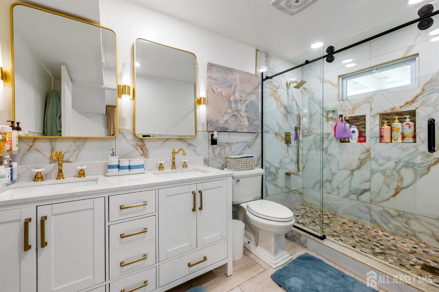 115 Vernon Way Port Reading, NJ 07064 - Photo 20 of 33 a bathroom with a sink toilet vanity and shower