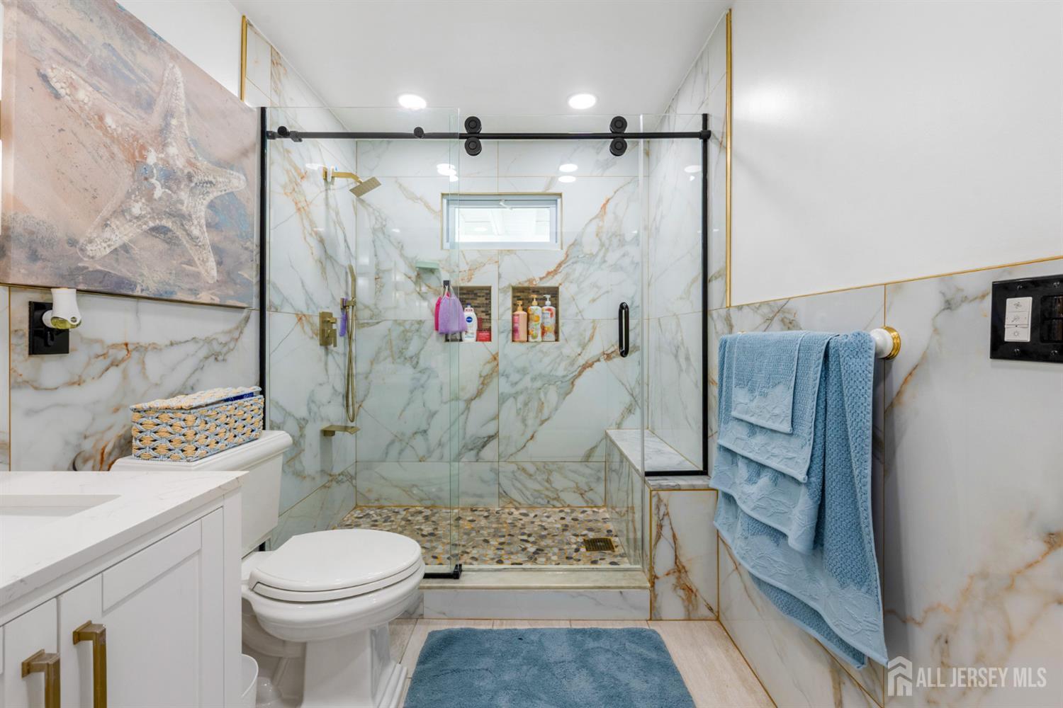 115 Vernon Way Port Reading, NJ 07064 - Photo 21 of 33 a bathroom with a granite countertop shower toilet and sink