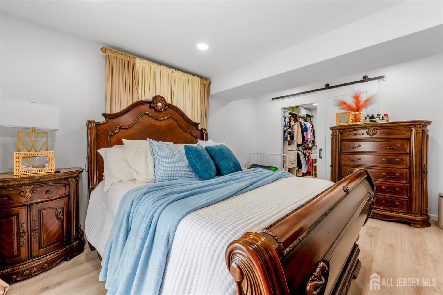 115 Vernon Way Port Reading, NJ 07064 - Photo 23 of 33 a bed room with a bed and a closet