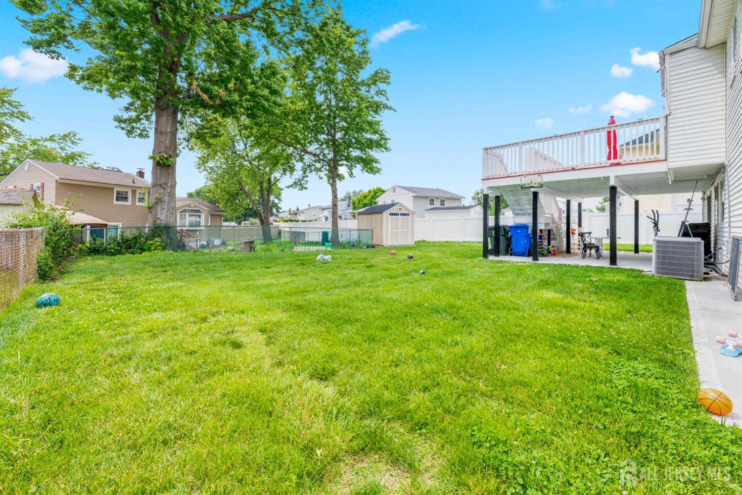 115 Vernon Way Port Reading, NJ 07064 - Photo 29 of 33 a view of a house with a big yard and large trees