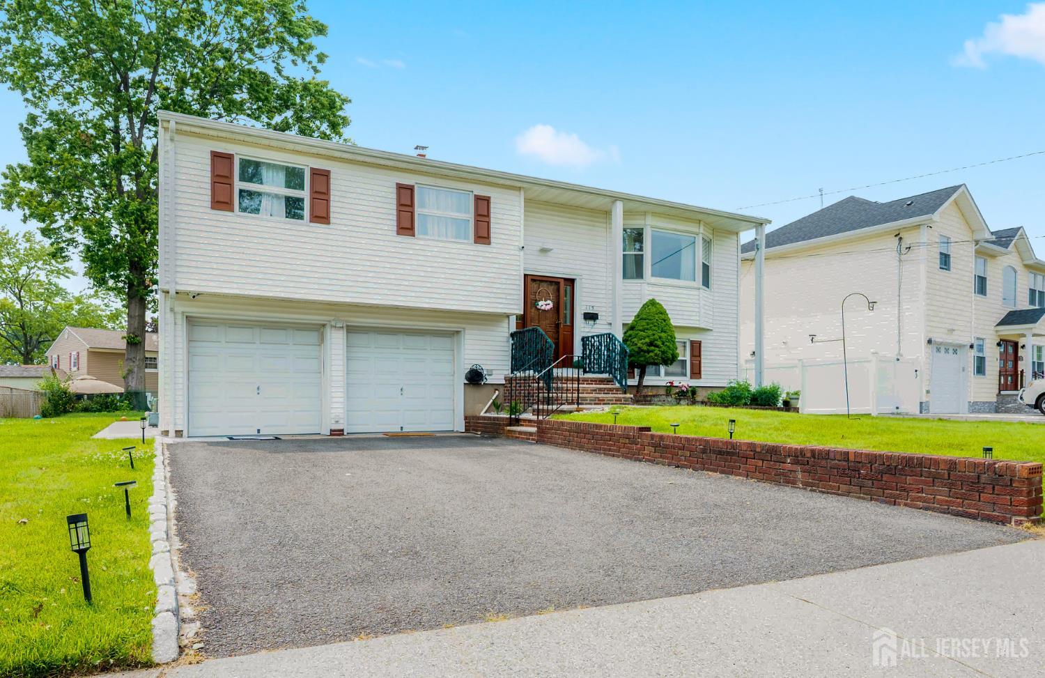 115 Vernon Way Port Reading, NJ 07064 - Photo 3 of 33 a house view with swimming pool in front of it