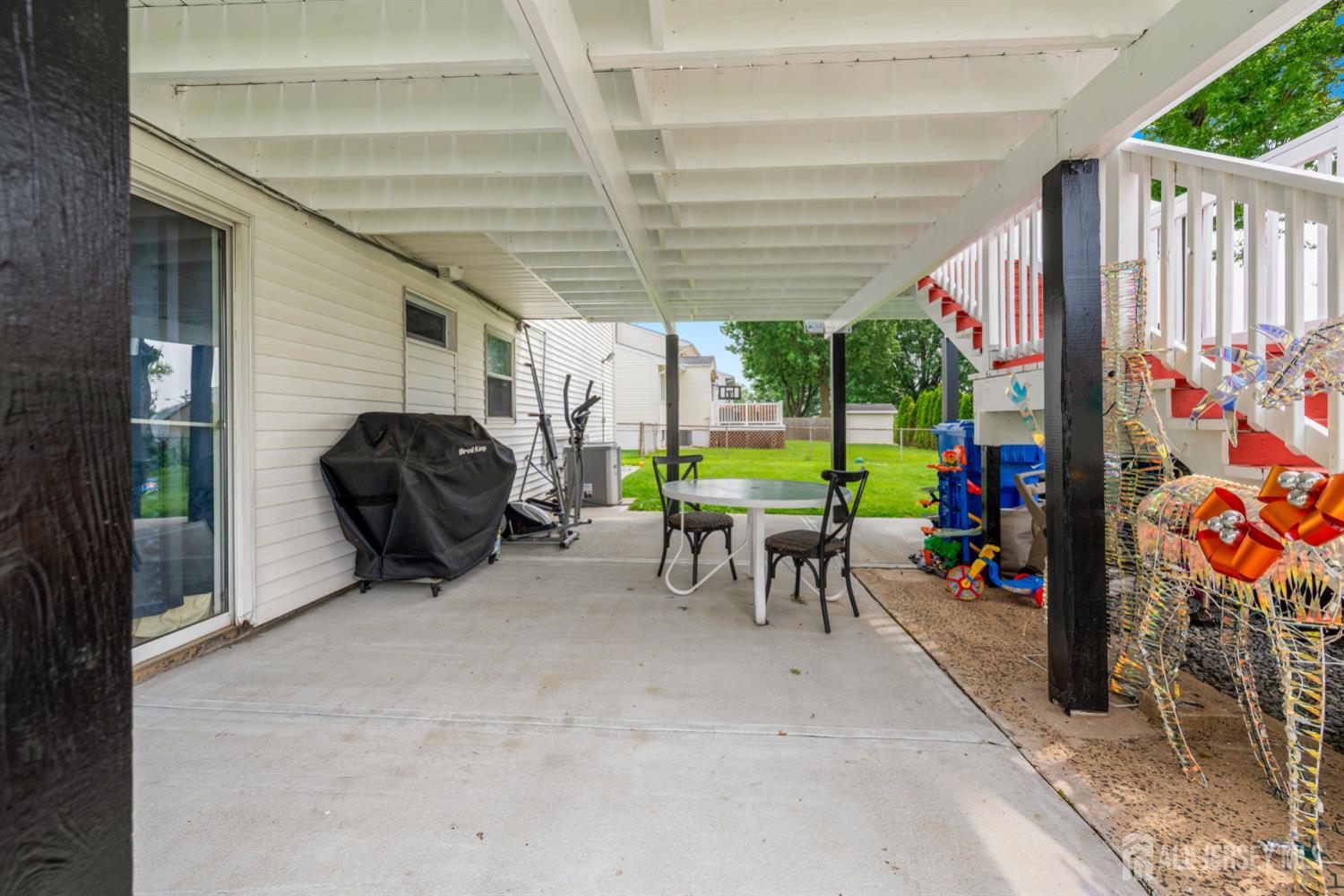 115 Vernon Way Port Reading, NJ 07064 - Photo 33 of 33 a view of a porch with furniture and a yard
