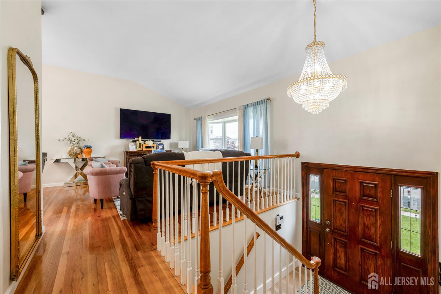 115 Vernon Way Port Reading, NJ 07064 - Photo 5 of 33 a view of a livingroom with furniture hardwood floor and staircase