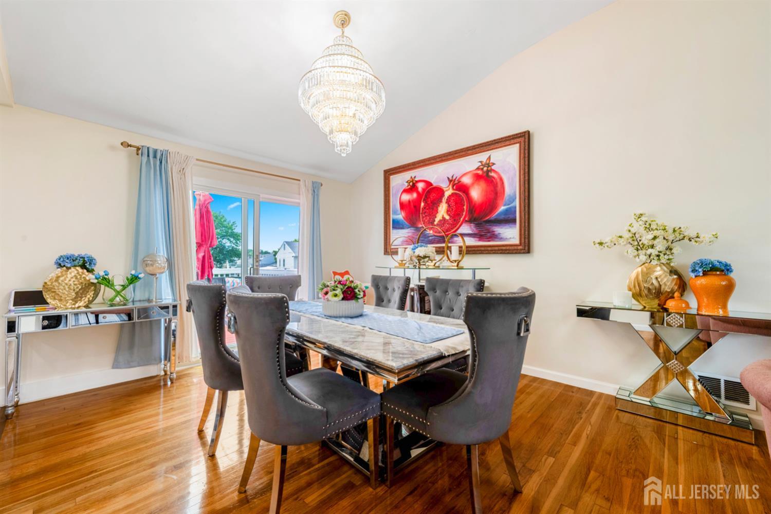 115 Vernon Way Port Reading, NJ 07064 - Photo 7 of 33 a view of a dining room with furniture wooden floor and chandelier