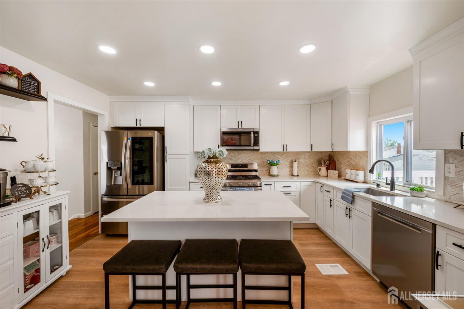 115 Vernon Way Port Reading, NJ 07064 - Photo 9 of 33 a large kitchen with stainless steel appliances lots of counter space and breakfast area
