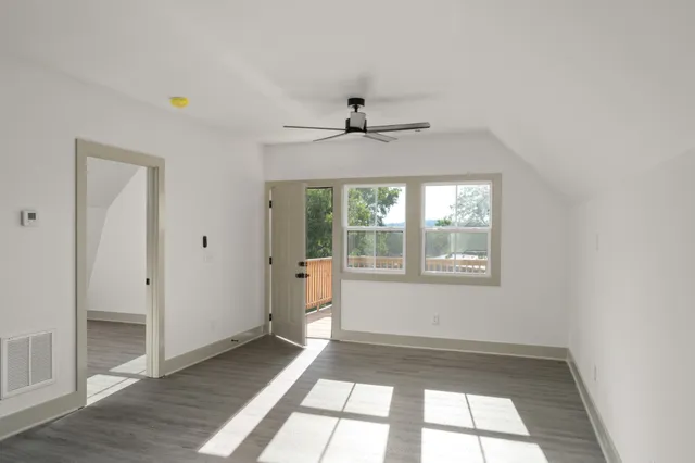 a view of an empty room with a window