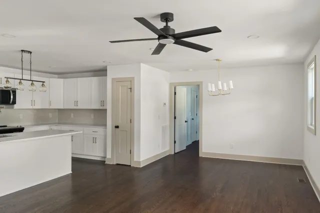 a view of a kitchen with a sink and dishwasher