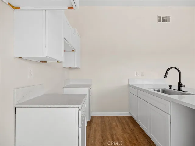 a view of storage and utility room with closet