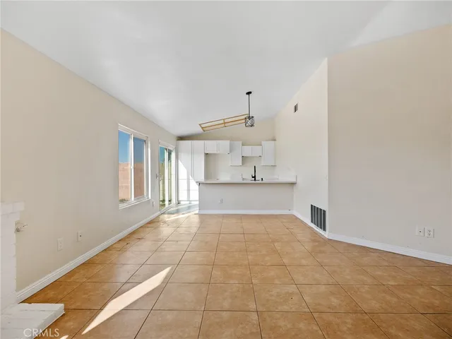 a view of a kitchen with a sink and dishwasher cabinets
