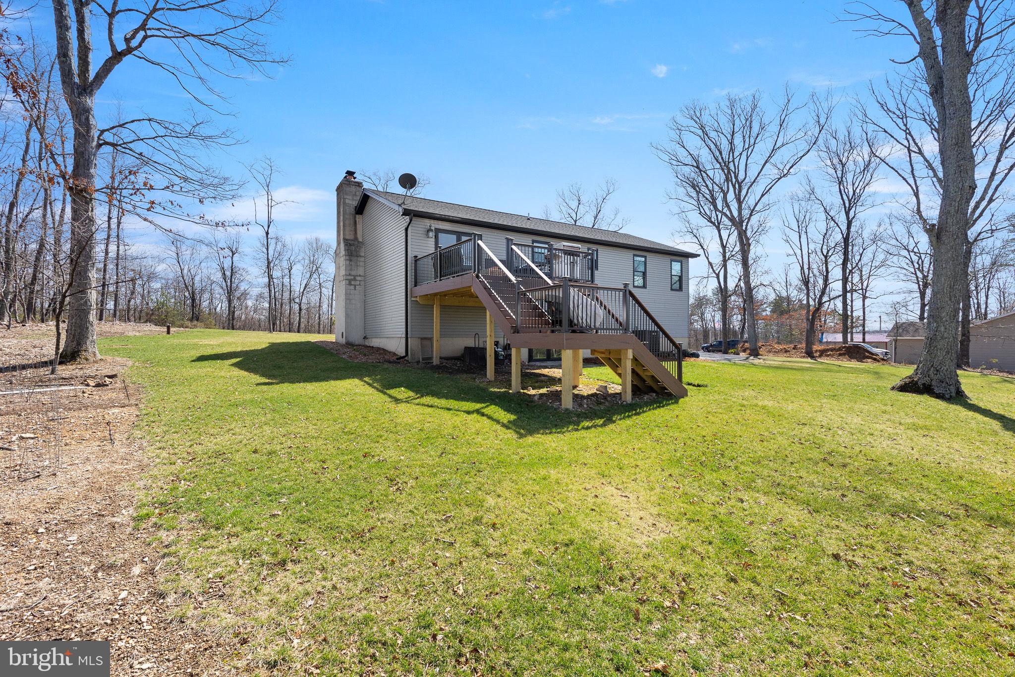80 Scotsmans Glen Road Capon Bridge, WV 26711 - Photo 25 of 33 Back yard and beautiful new deck to enjoy.