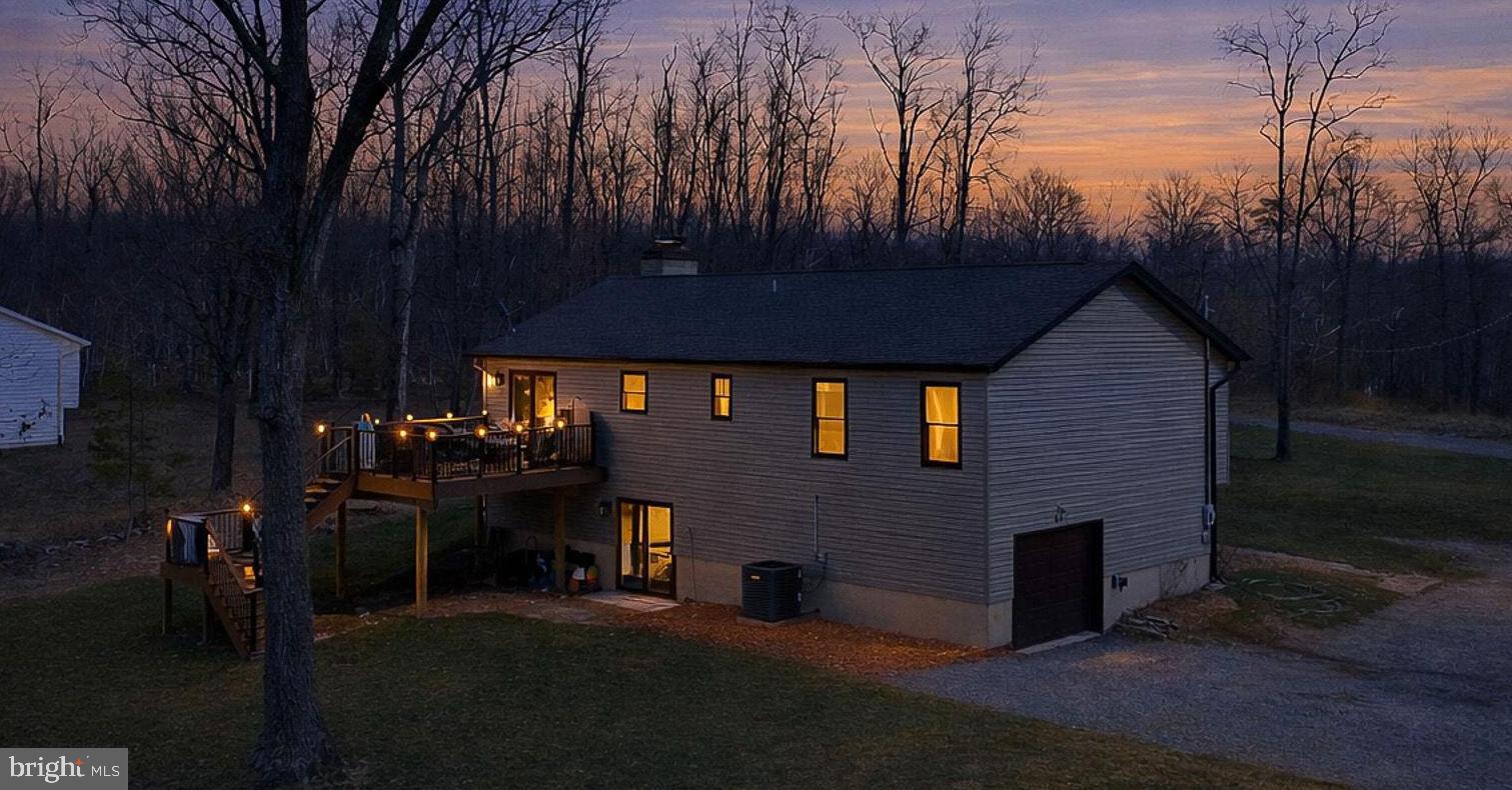 80 Scotsmans Glen Road Capon Bridge, WV 26711 - Photo 29 of 33 Back of house with deck lite up. beautiful...