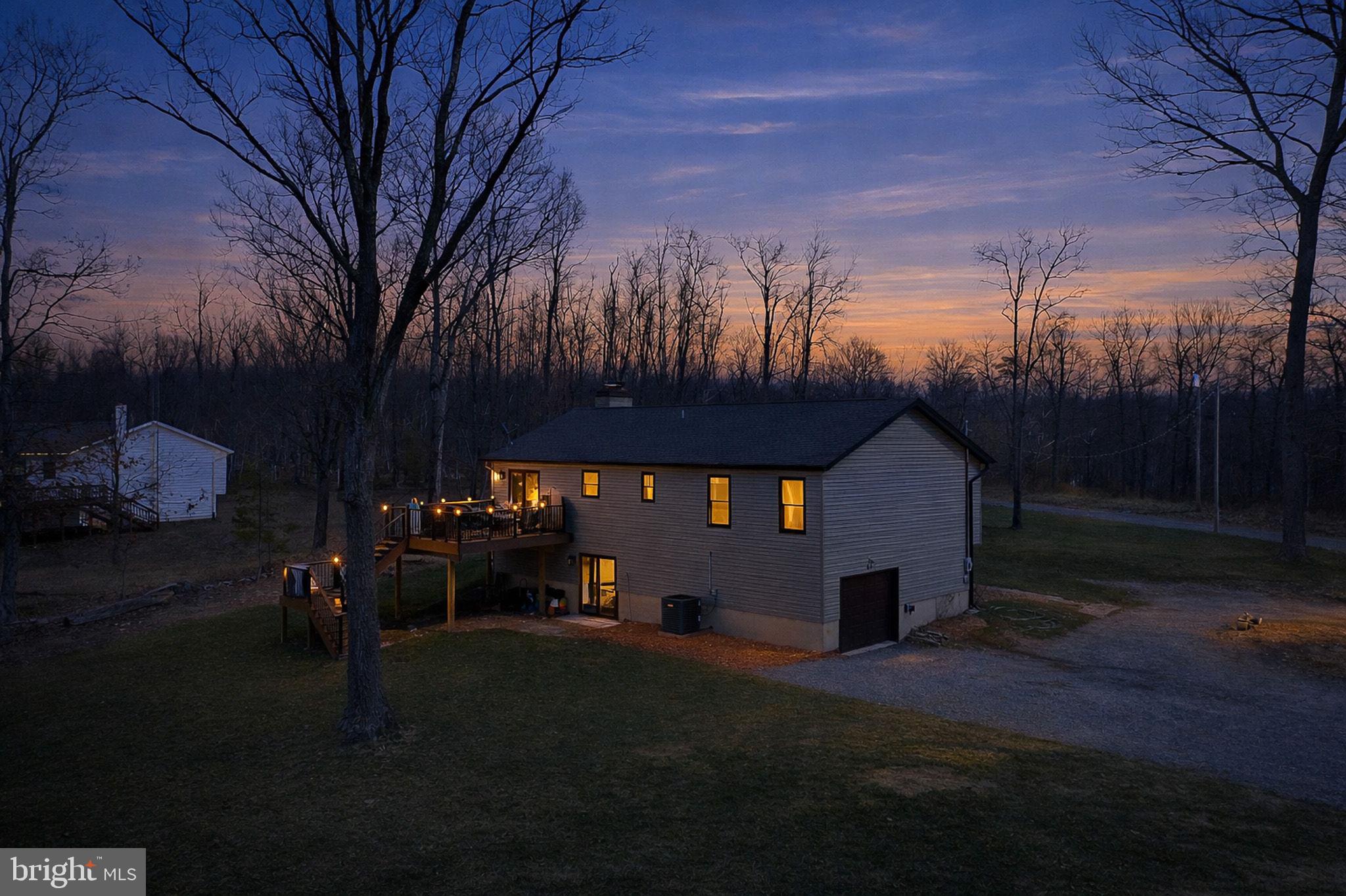 80 Scotsmans Glen Road Capon Bridge, WV 26711 - Photo 3 of 33 Timbertech new deck (2025) w/ lights on all posts.
