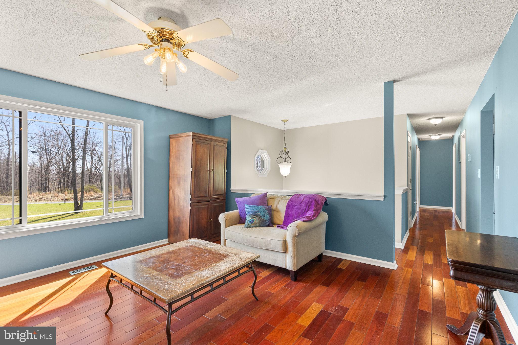 80 Scotsmans Glen Road Capon Bridge, WV 26711 - Photo 9 of 33 Living room with solid Brazin Cherry flooring!