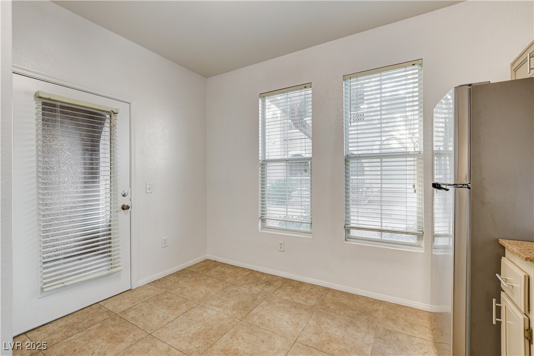 9975 Peace Way, Unit 1034 Las Vegas, NV 89147 - Photo 20 of 73 kitchen nook and patio door