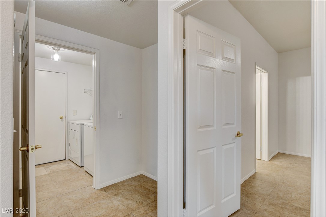 9975 Peace Way, Unit 1034 Las Vegas, NV 89147 - Photo 27 of 73 laundry room separate and garage entry to the home