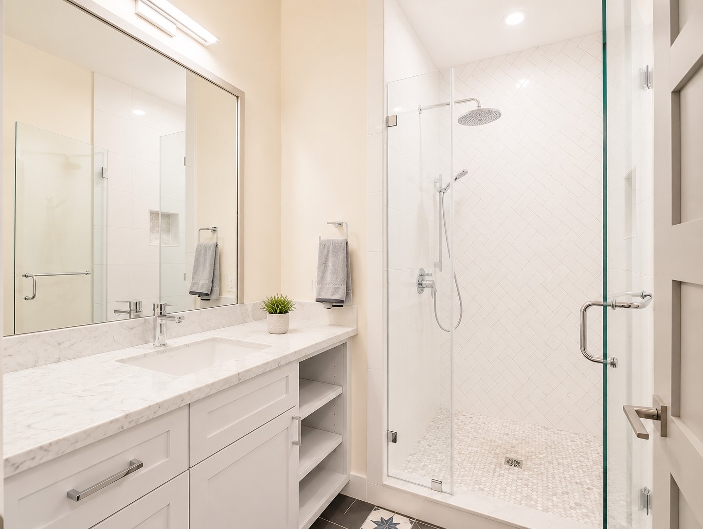 2302 Ruth Street Houston, TX 77004 - Photo 7 of 18 The first floor primary bath with extended vanity & linen storage.