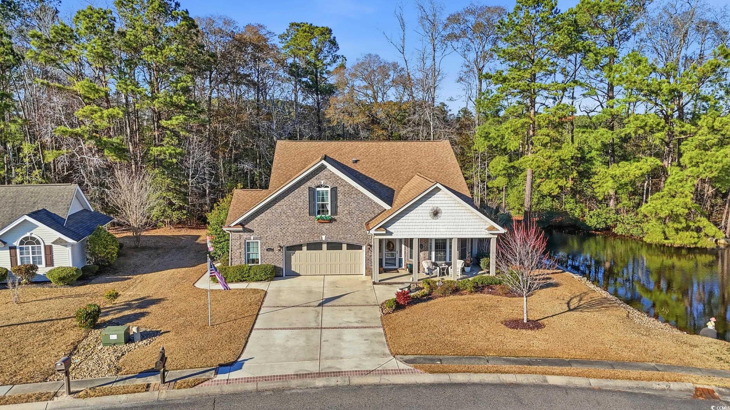 452 Deer Watch Circle Longs, SC 29568 - Photo 2 of 39 View of front facade featuring covered porch, concrete driveway, a garage, and roof with shingles