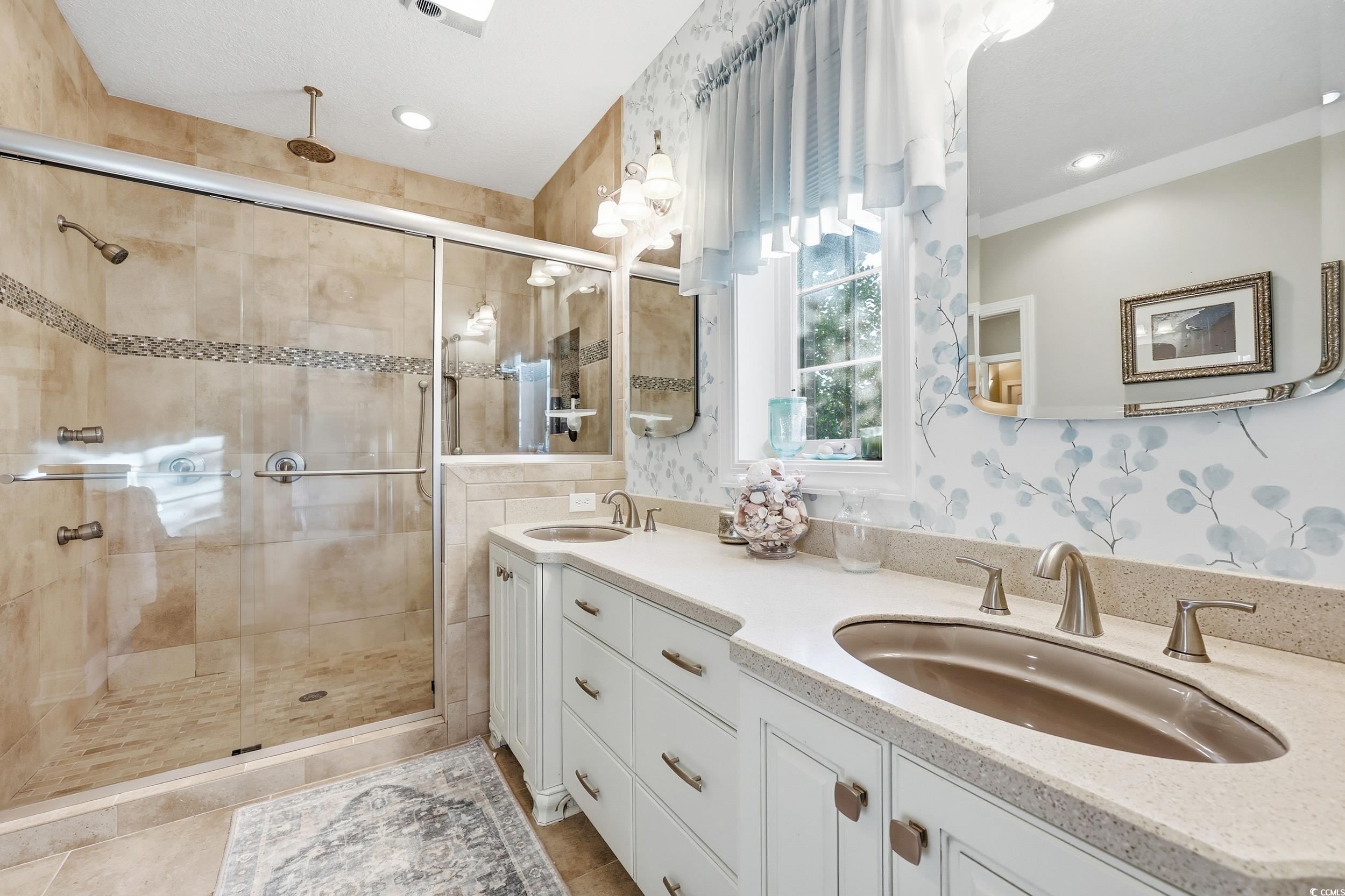 452 Deer Watch Circle Longs, SC 29568 - Photo 21 of 39 Main level primary bathroom with double vanity and a walk in shower.