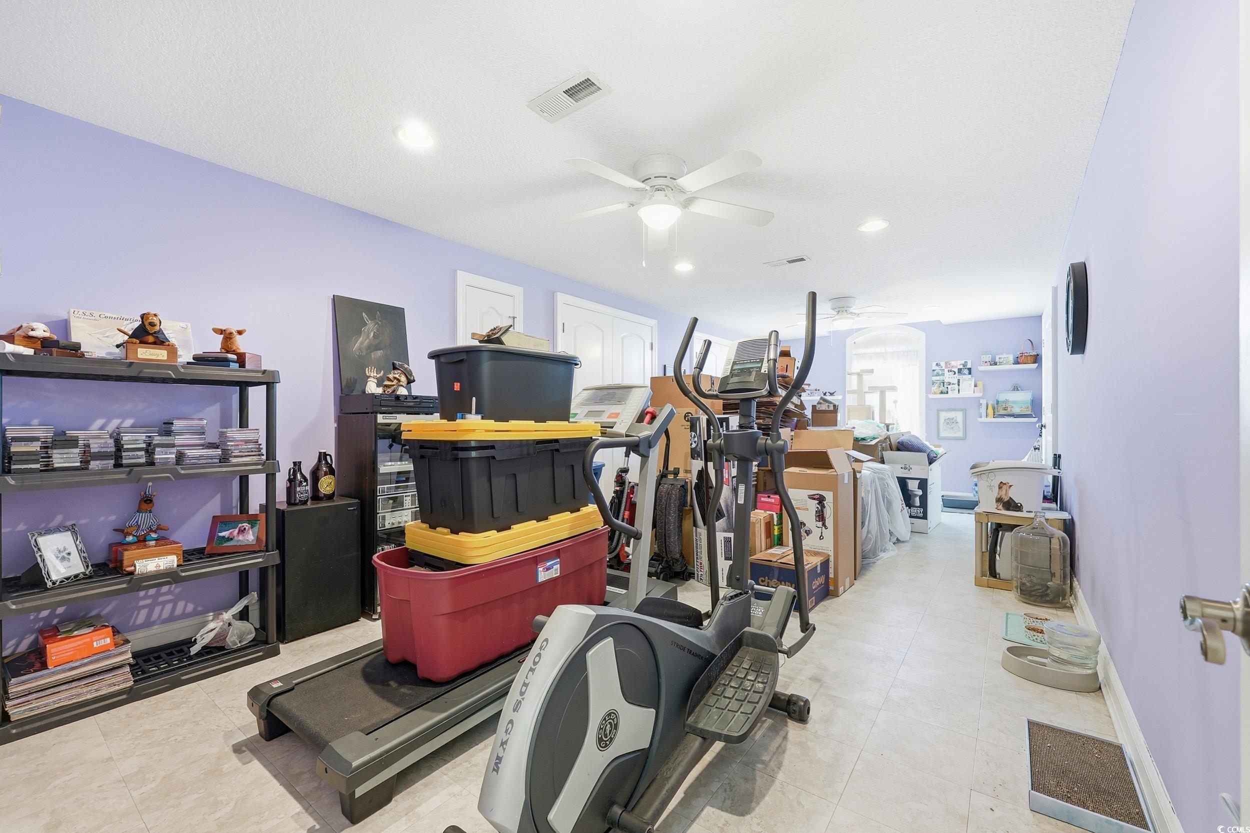 452 Deer Watch Circle Longs, SC 29568 - Photo 29 of 39 Exercise room with a ceiling fan, recessed lighting, and light tile patterned flooring