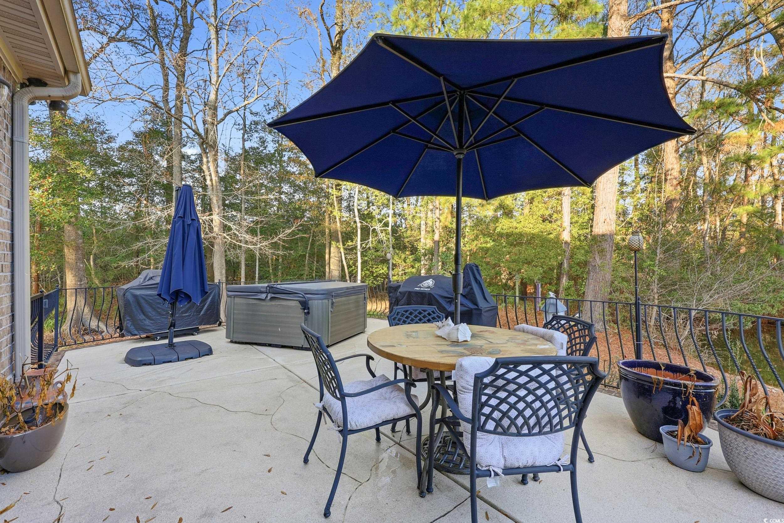 452 Deer Watch Circle Longs, SC 29568 - Photo 31 of 39 View of patio / terrace featuring a hot tub, outdoor dining space, and area for grilling