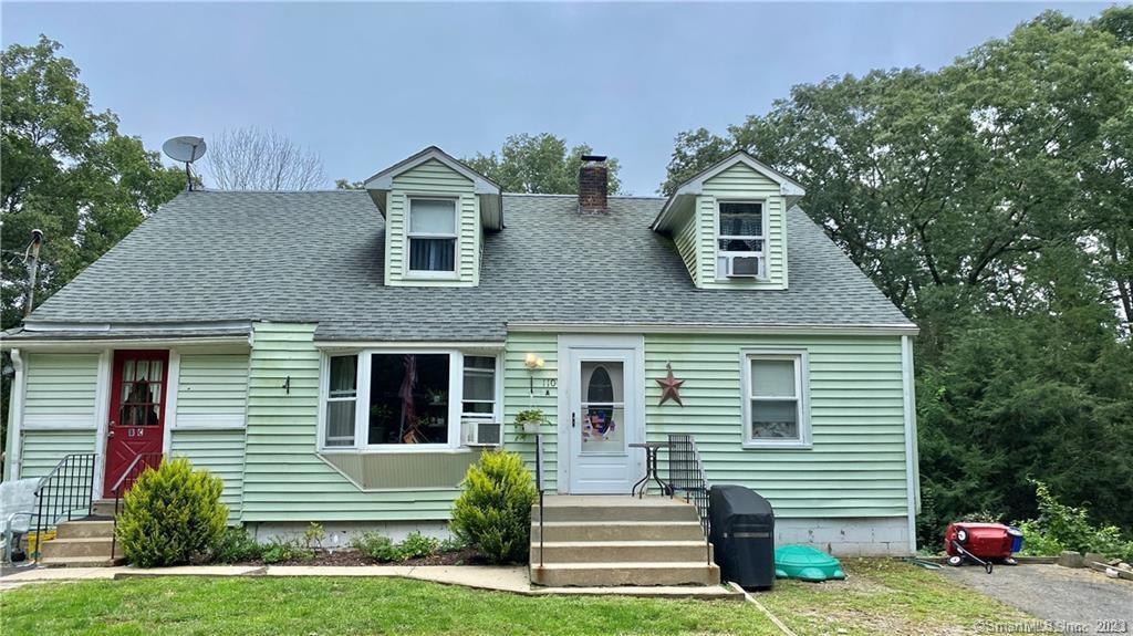 Front of house White door entrance to apartment