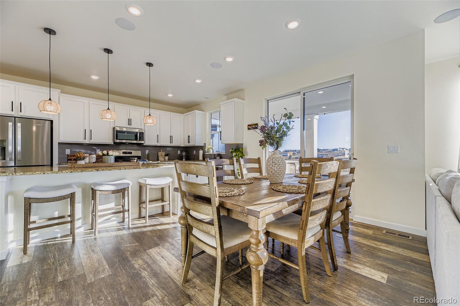 1126 Williams Loop Elizabeth, CO 80107 - Photo 14 of 50 a kitchen with kitchen island wooden cabinets and stainless steel appliances