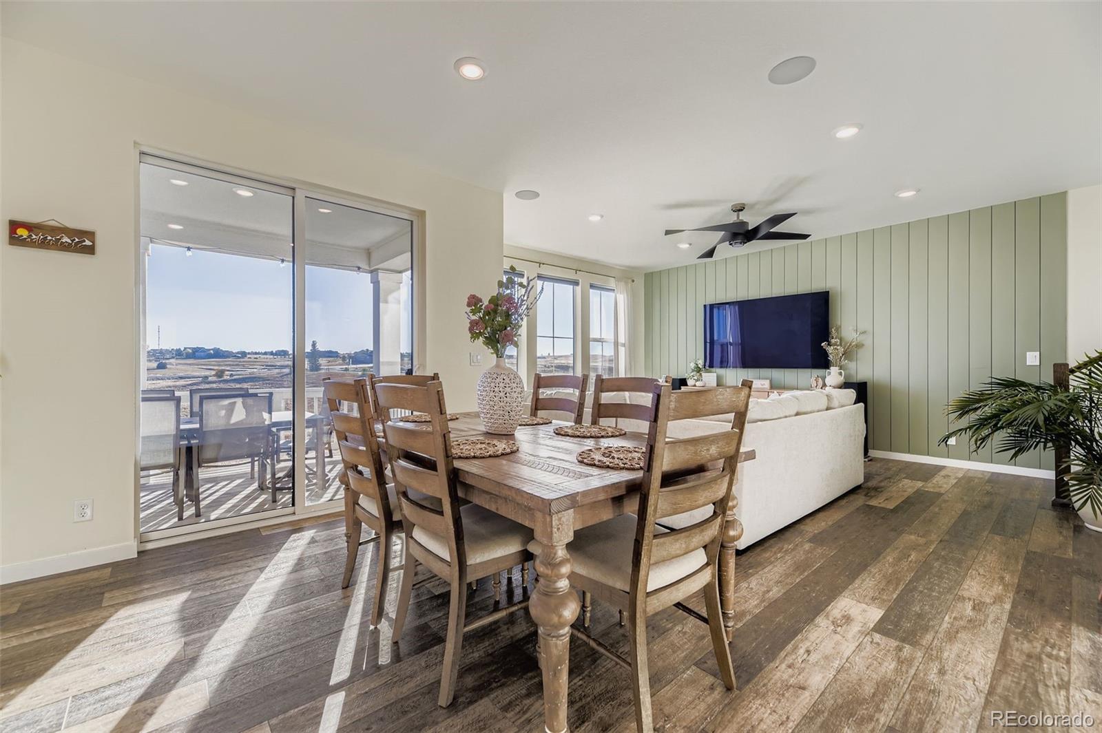 1126 Williams Loop Elizabeth, CO 80107 - Photo 15 of 50 a view of a dining room with furniture window and wooden floor
