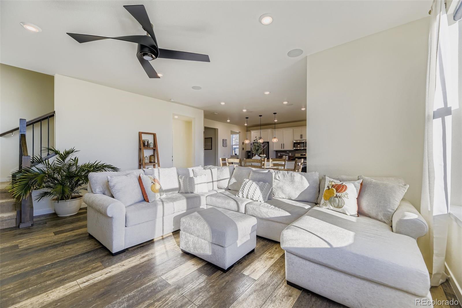 1126 Williams Loop Elizabeth, CO 80107 - Photo 18 of 50 a living room with furniture and a potted plant