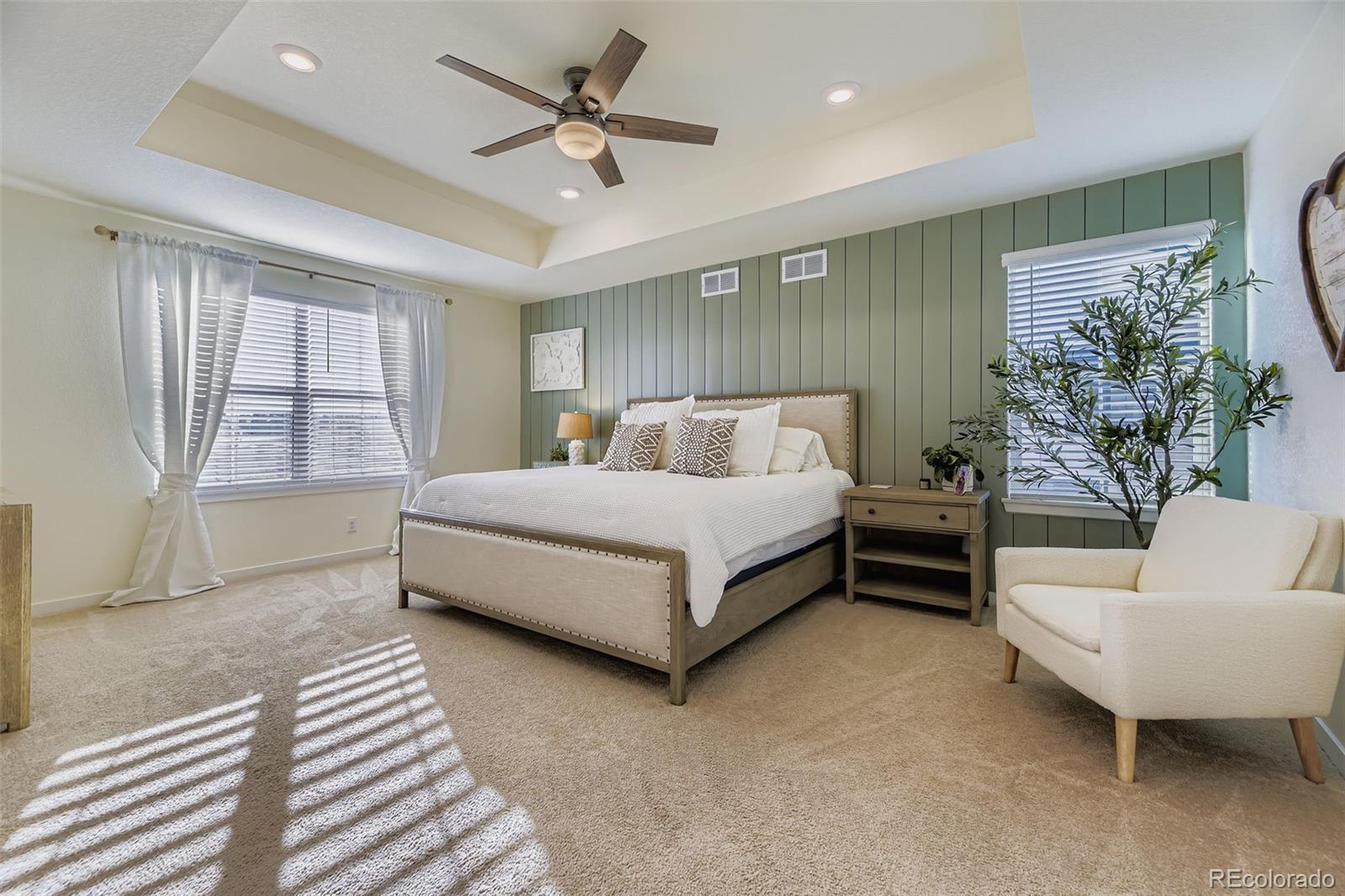 1126 Williams Loop Elizabeth, CO 80107 - Photo 19 of 50 a bedroom with a large bed and a couch