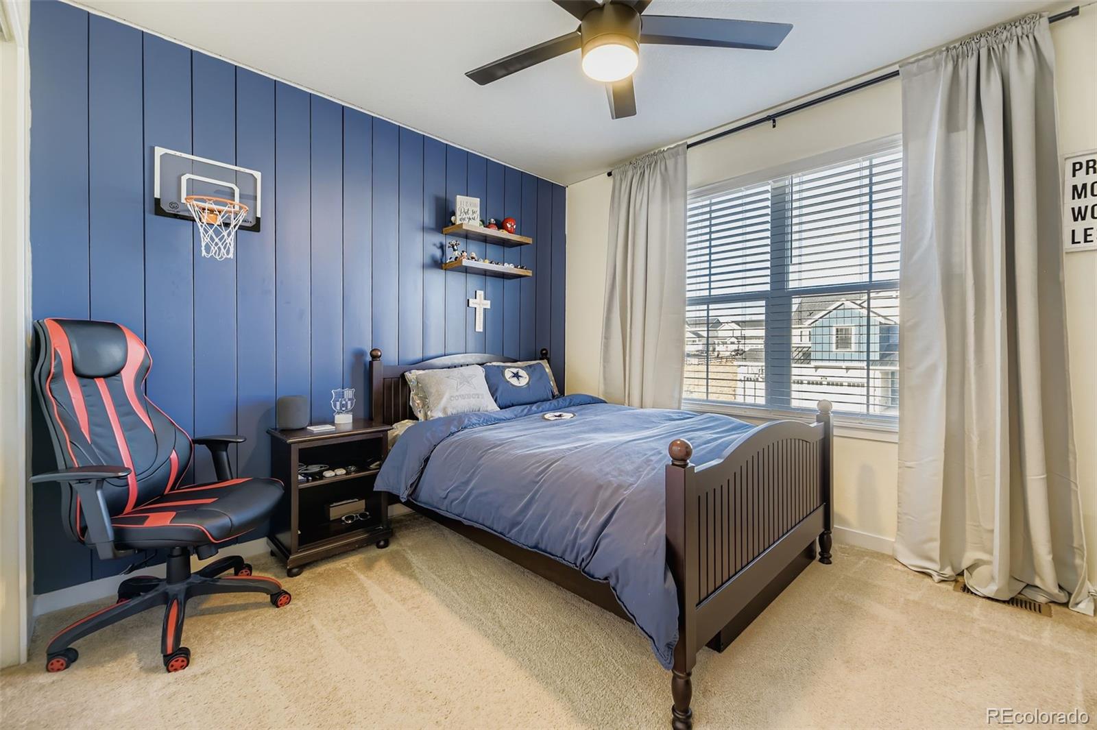 1126 Williams Loop Elizabeth, CO 80107 - Photo 26 of 50 a bed room with a bed and a chair