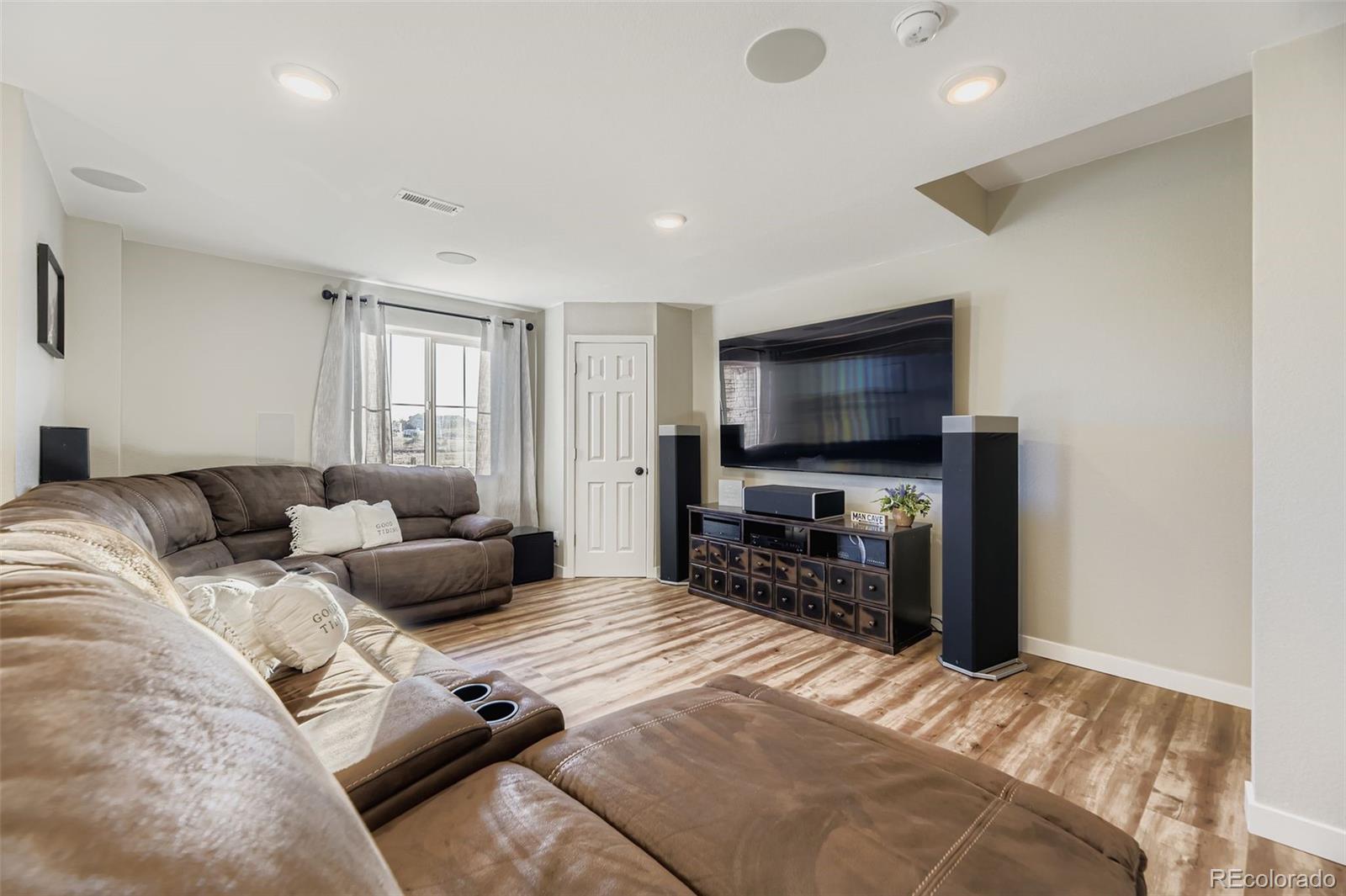 1126 Williams Loop Elizabeth, CO 80107 - Photo 30 of 50 a bedroom with a bed and a flat screen tv