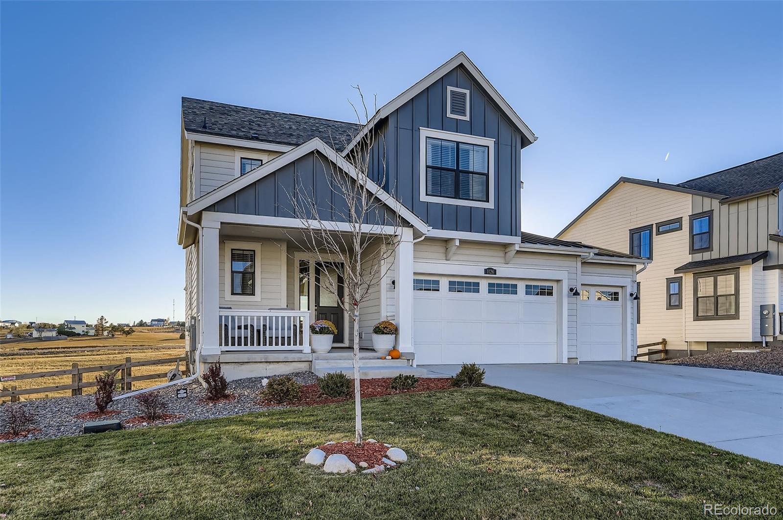1126 Williams Loop Elizabeth, CO 80107 - Photo 3 of 50 a front view of a house with a yard
