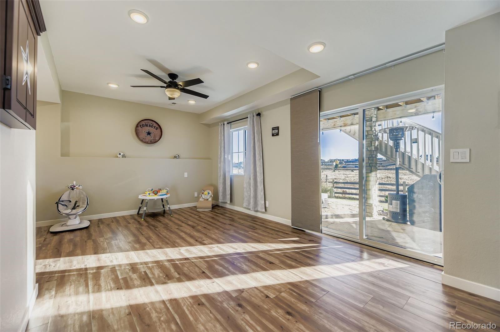 1126 Williams Loop Elizabeth, CO 80107 - Photo 31 of 50 a bedroom with a bed and a chandelier