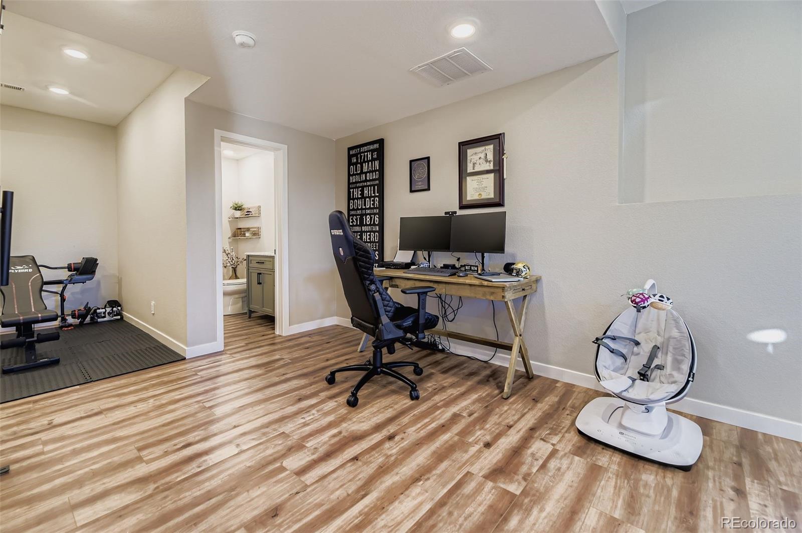 1126 Williams Loop Elizabeth, CO 80107 - Photo 33 of 50 a view of a workspace with furniture and a bedroom