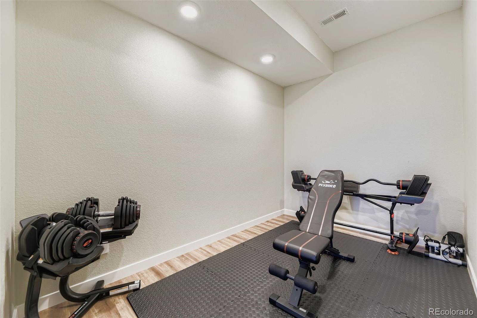 1126 Williams Loop Elizabeth, CO 80107 - Photo 34 of 50 a view of a room with gym equipment
