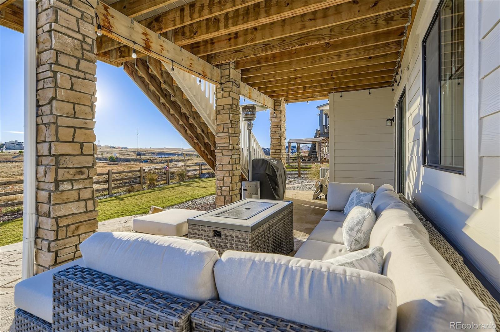 1126 Williams Loop Elizabeth, CO 80107 - Photo 38 of 50 a living room with furniture and a large window