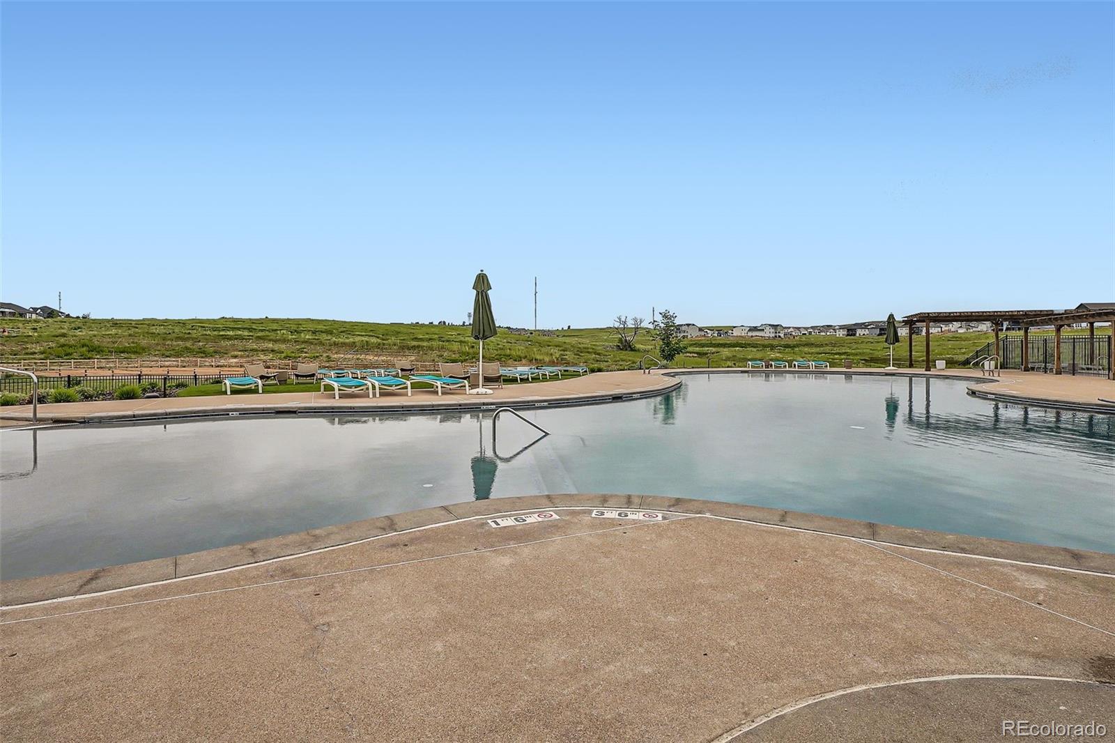 1126 Williams Loop Elizabeth, CO 80107 - Photo 45 of 50 a view of a lake with houses