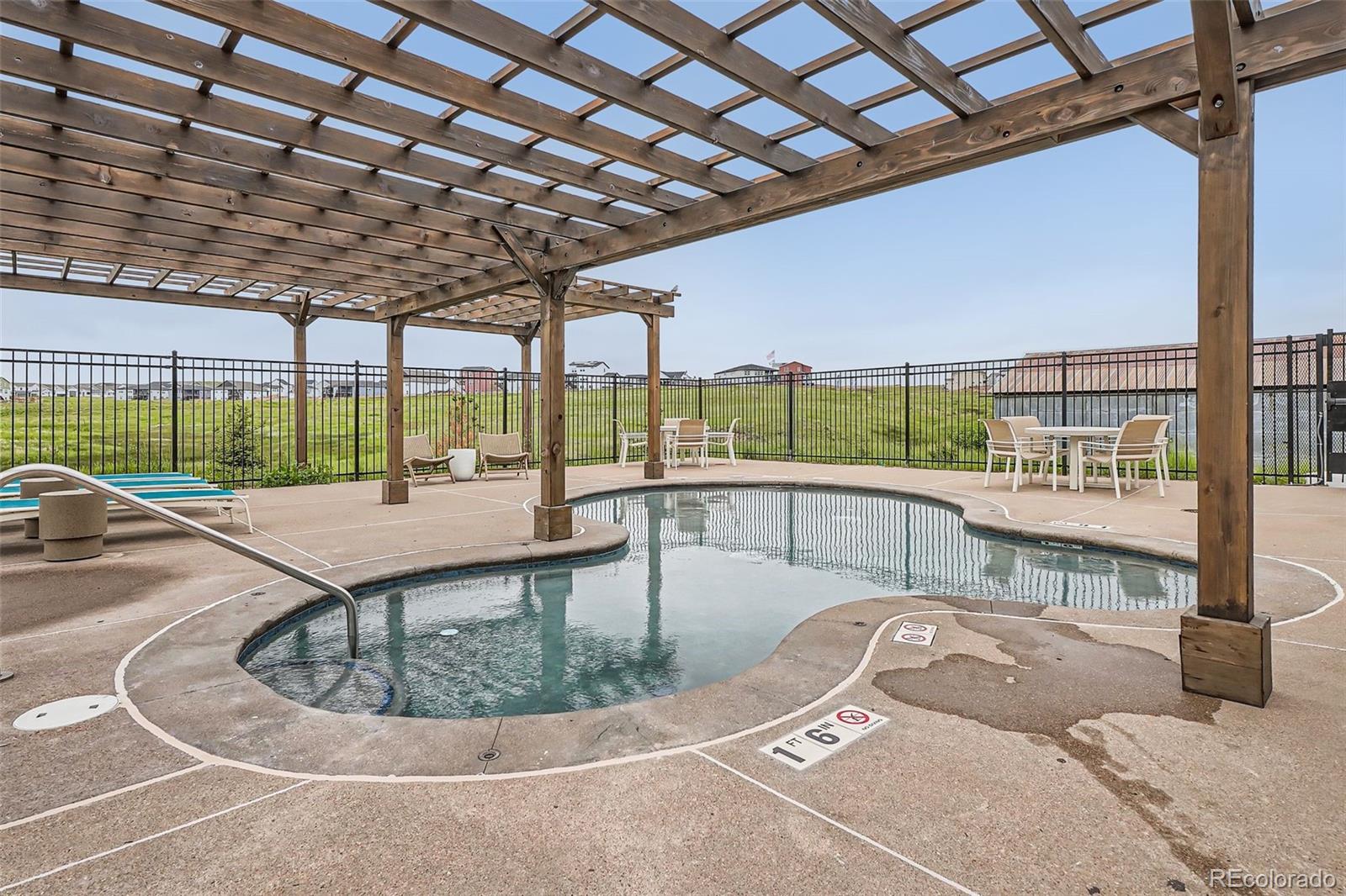 1126 Williams Loop Elizabeth, CO 80107 - Photo 46 of 50 a view of a swimming pool with a patio